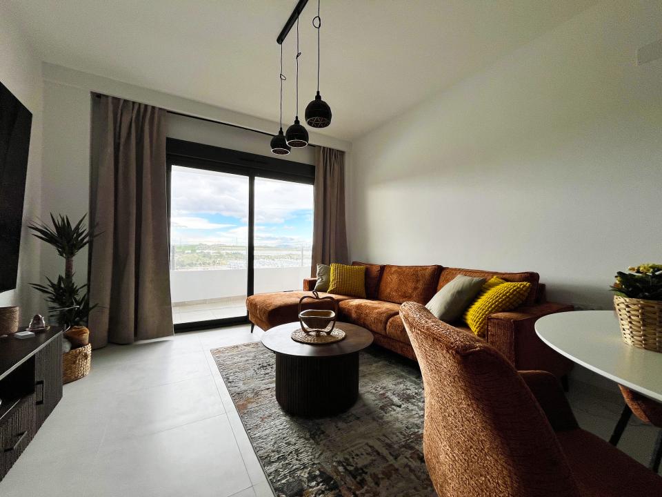 Large living room with 98" flat TV, minibar and Playstation 5 